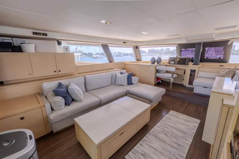  Yacht Photos Pics Luxurious interior of 2017 Fountaine Pajot Ipanema 58 yacht with modern furnishings and panoramic windows.