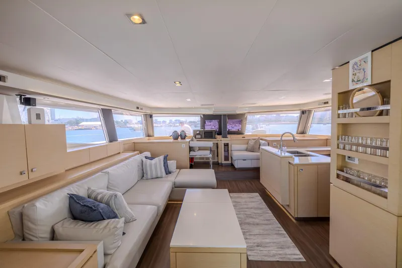  Yacht Photos Pics Luxurious interior of 2017 Fountaine Pajot Ipanema 58 catamaran with modern furnishings.