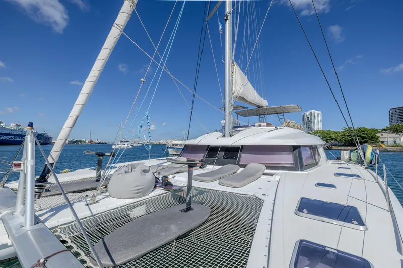  Yacht Photos Pics 2017 Fountaine Pajot Ipanema 58 catamaran docked in a sunny marina.