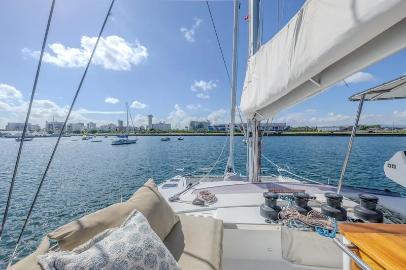  Yacht Photos Pics Luxurious 2017 Fountaine Pajot Ipanema 58 catamaran sailing in a sunny harbor.