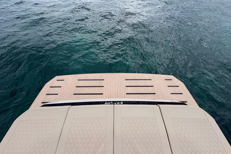 2025 De Antonio Yachts D42 @ Cancun Yacht Photos Pics Stern view of 2025 De Antonio Yachts D42 on calm water.