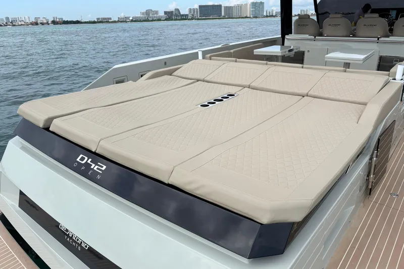 2025 De Antonio Yachts D42 @ Cancun Yacht Photos Pics 2025 De Antonio Yachts D42 with spacious sun deck, docked by the waterfront.