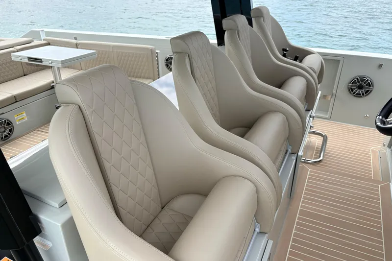 2025 De Antonio Yachts D42 @ Cancun Yacht Photos Pics Luxurious seating on 2025 De Antonio Yachts D42, featuring elegant beige upholstery and modern design.