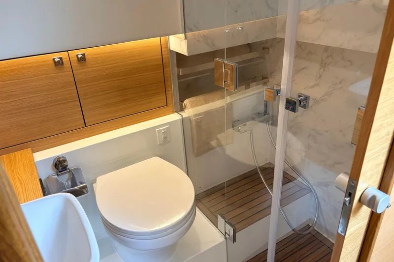 2025 De Antonio Yachts D42 @ Cancun Yacht Photos Pics Luxurious bathroom in 2025 De Antonio Yachts D42, featuring modern fixtures and elegant wood accents.