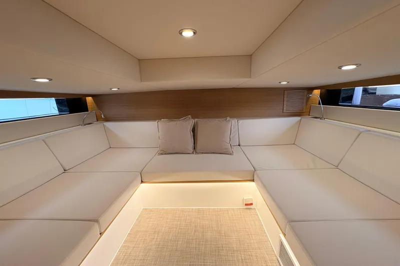 2025 De Antonio Yachts D42 @ Cancun Yacht Photos Pics Luxurious interior of 2025 De Antonio Yachts D42 with elegant seating and ambient lighting.