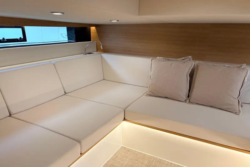 2025 De Antonio Yachts D42 @ Cancun Yacht Photos Pics Luxurious interior of 2025 De Antonio Yachts D42 with elegant seating and ambient lighting.