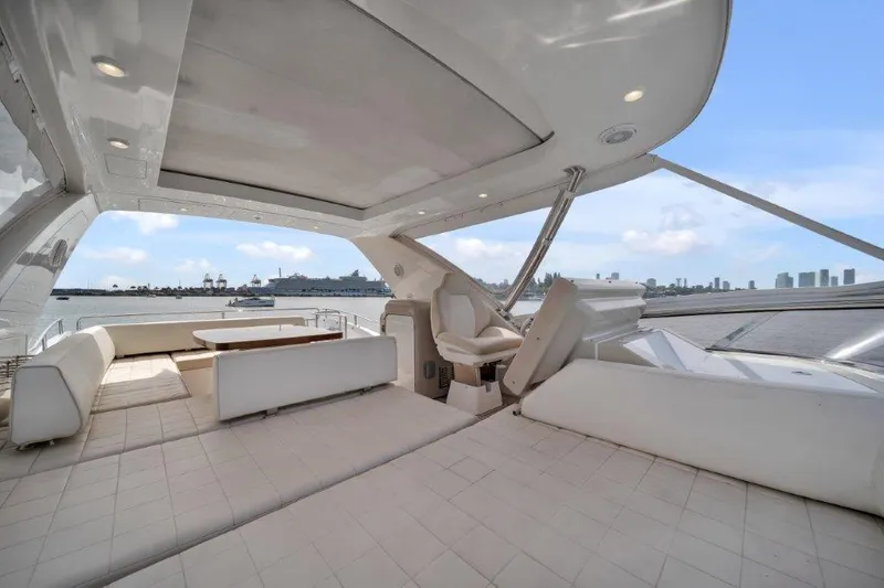  Yacht Photos Pics Luxurious 2014 Azimut 64 Flybridge yacht interior with spacious seating and scenic ocean view.