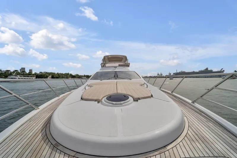  Yacht Photos Pics Azimut 64 Flybridge 2014 yacht on water, showcasing sleek deck and luxurious design.