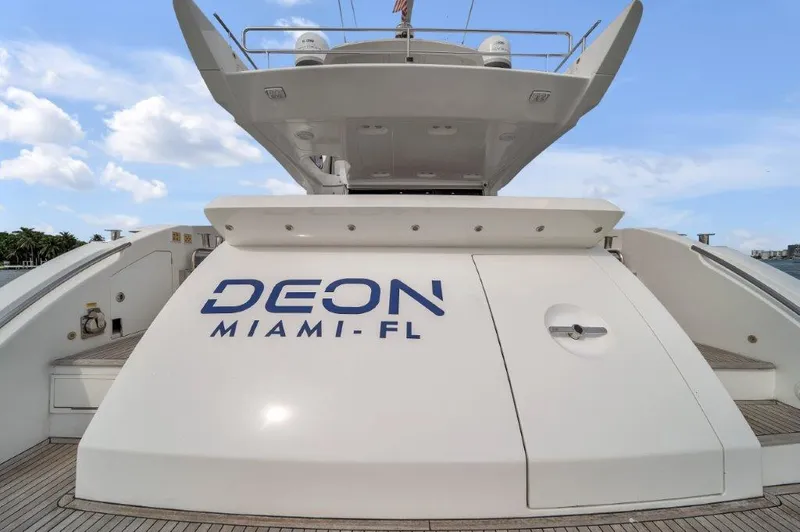  Yacht Photos Pics Azimut 64 Flybridge 2014 yacht with "DEON MIAMI-FL" text, docked under a clear sky.