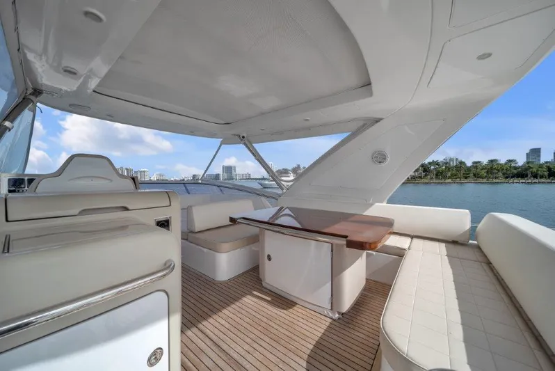  Yacht Photos Pics Luxurious 2014 Azimut 64 Flybridge yacht interior with elegant seating and wooden table.