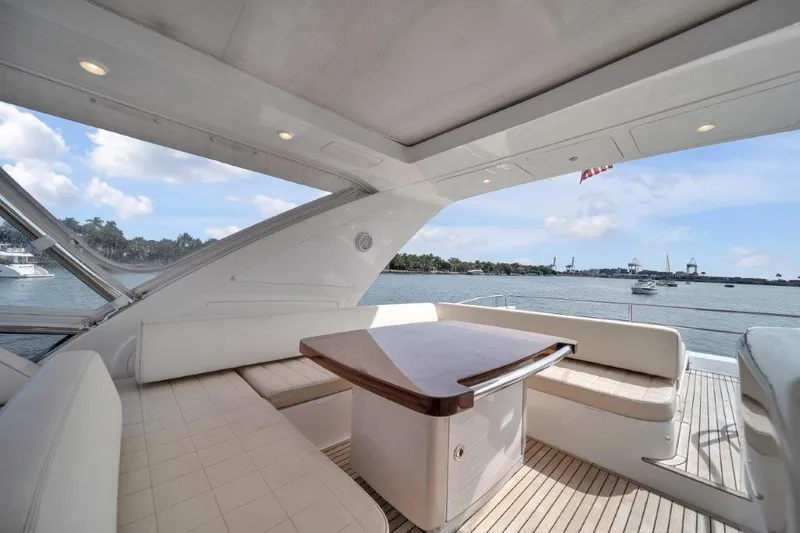 Yacht Photos Pics Luxurious 2014 Azimut 64 Flybridge yacht with elegant seating and scenic ocean view.