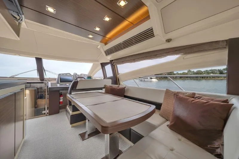  Yacht Photos Pics Luxurious interior of 2014 Azimut 64 Flybridge yacht with elegant seating and dining area.