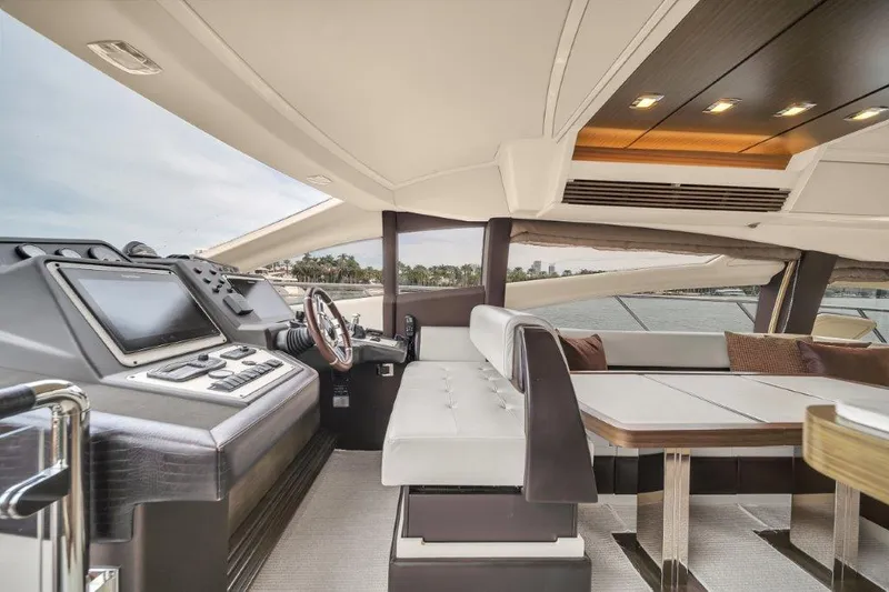  Yacht Photos Pics 2014 Azimut 64 Flybridge yacht interior with modern helm and luxurious seating.