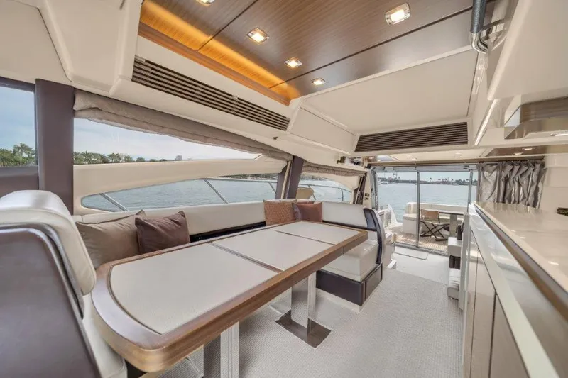  Yacht Photos Pics Luxurious interior of 2014 Azimut 64 Flybridge yacht with elegant dining area.