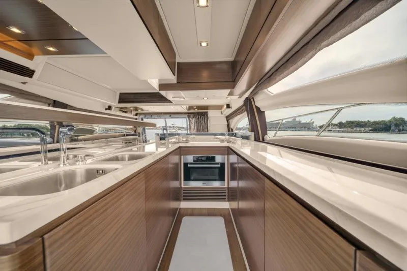  Yacht Photos Pics Luxurious kitchen interior of 2014 Azimut 64 Flybridge yacht with modern design.