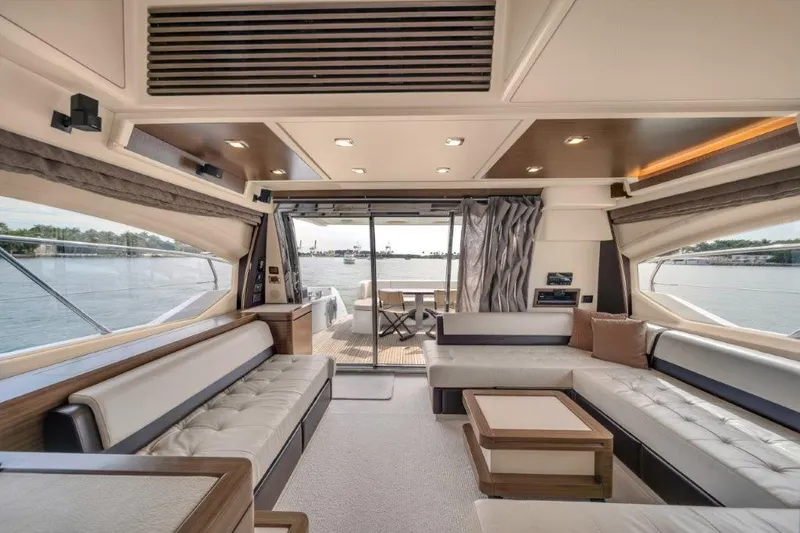  Yacht Photos Pics Luxurious interior of 2014 Azimut 64 Flybridge yacht with elegant seating and scenic water views.