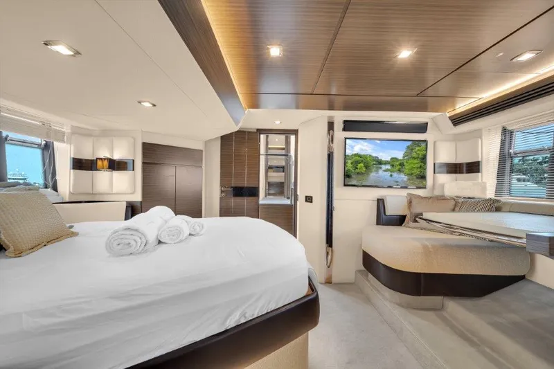  Yacht Photos Pics Luxurious interior of 2014 Azimut 64 Flybridge yacht with elegant bedroom and scenic window view.