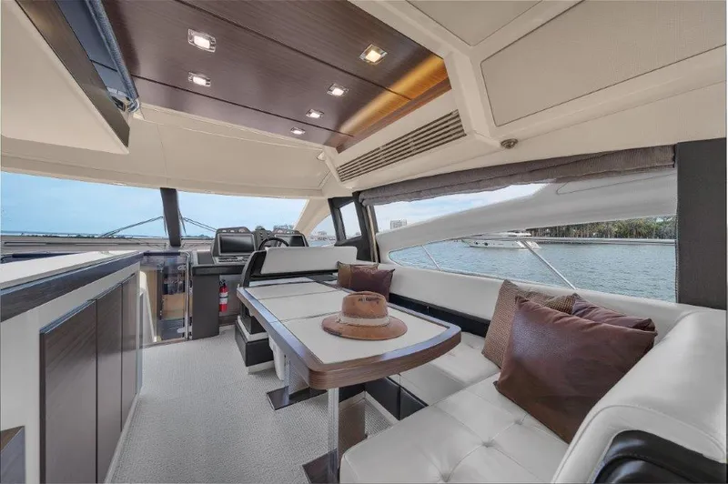  Yacht Photos Pics Luxurious interior of 2014 Azimut 64 Flybridge yacht with elegant seating and scenic views.