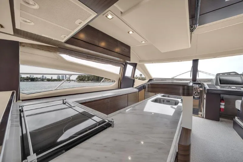  Yacht Photos Pics Luxurious interior of a 2014 Azimut 64 Flybridge yacht with modern design and panoramic windows.