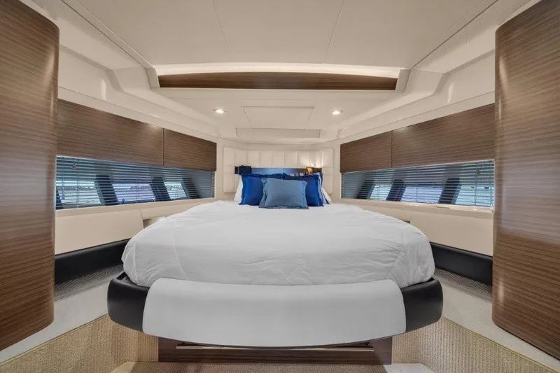  Yacht Photos Pics Luxurious bedroom interior of 2014 Azimut 64 Flybridge yacht with modern design and cozy bedding.