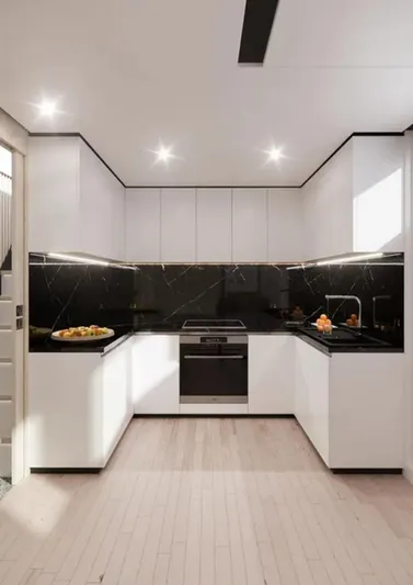 Tureddi 92 Yacht Photos Pics Modern kitchen with white cabinets, black marble backsplash, and sleek appliances, Tureddi 92 model, 2026.