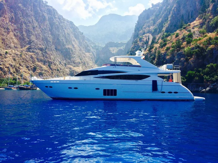 Vixen Yacht Photos Pics Luxurious 2011 Princess 85 Motor Yacht cruising in scenic mountainous waters.