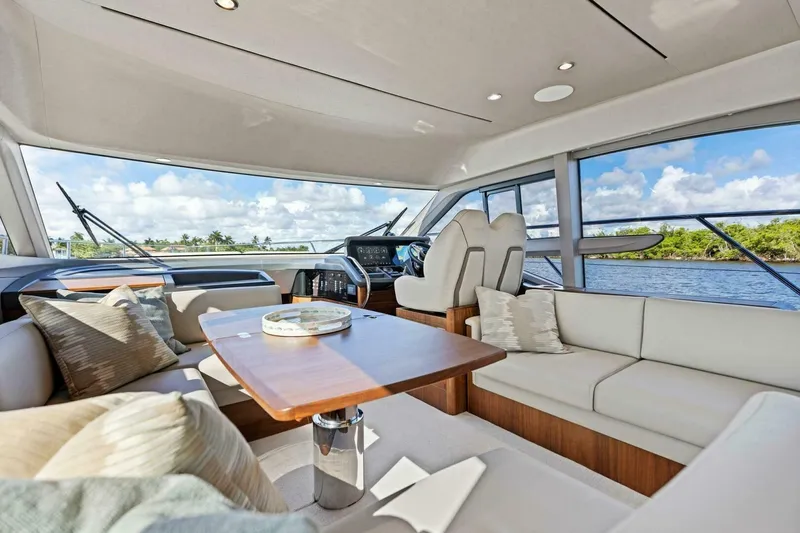 Twin Magic Yacht Photos Pics Luxurious interior of 2025 Princess F50 yacht with elegant seating and scenic views.