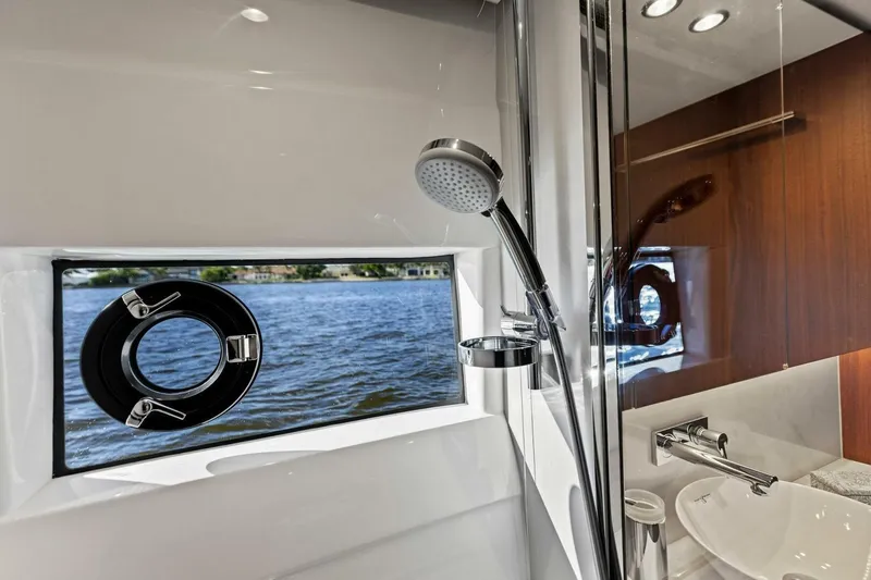Twin Magic Yacht Photos Pics Luxurious bathroom on 2025 Princess F50 yacht with shower and ocean view.