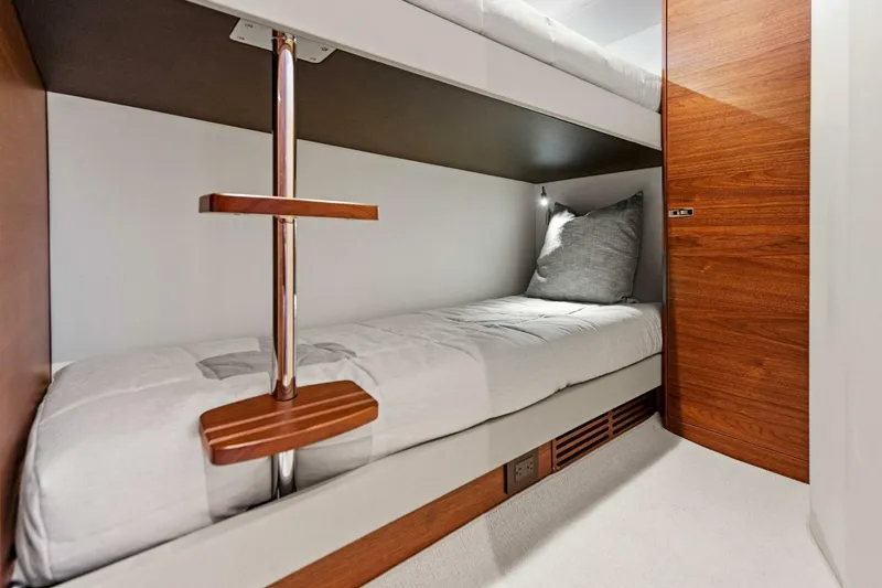 Twin Magic Yacht Photos Pics Bunk bed in 2025 Princess F50 yacht cabin with wooden accents and modern design.