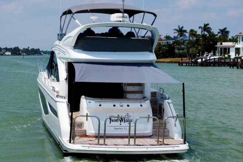 Twin Magic Yacht Photos Pics Luxury Princess F50 yacht cruising in sunny waters, 2025 model.