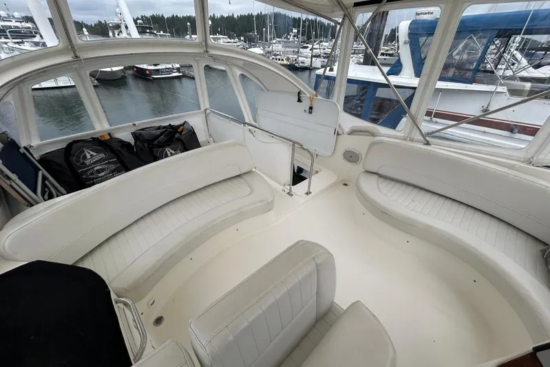  Yacht Photos Pics 2004 Meridian 411 Sedan interior with white seating, docked at marina.