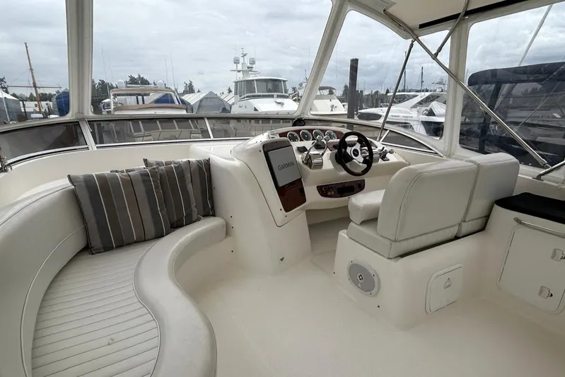  Yacht Photos Pics 2004 Meridian 411 Sedan yacht interior with helm, seating, and marina view.