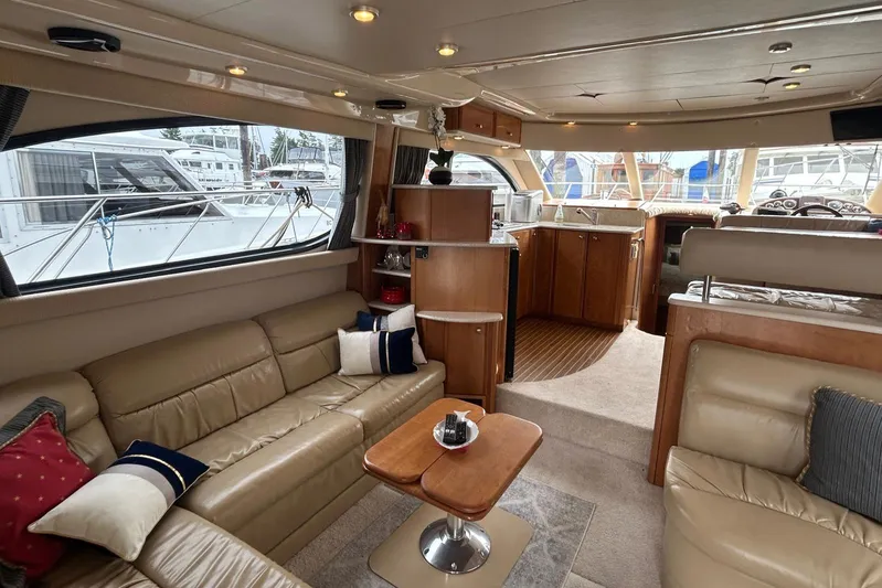  Yacht Photos Pics Luxurious interior of 2004 Meridian 411 Sedan yacht with leather seating and modern amenities.