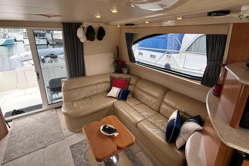  Yacht Photos Pics Luxurious interior of a 2004 Meridian 411 Sedan yacht with leather seating and nautical decor.