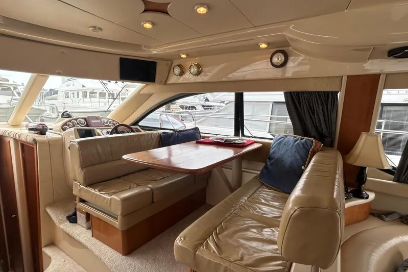 Yacht Photos Pics Luxurious interior of a 2004 Meridian 411 Sedan yacht with leather seating and dining area.