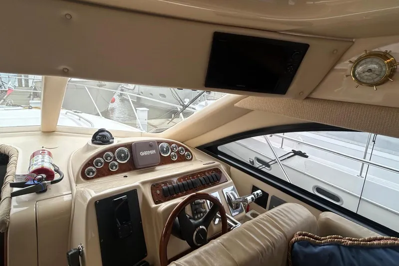  Yacht Photos Pics Interior of 2004 Meridian 411 Sedan yacht with steering wheel and control panel.