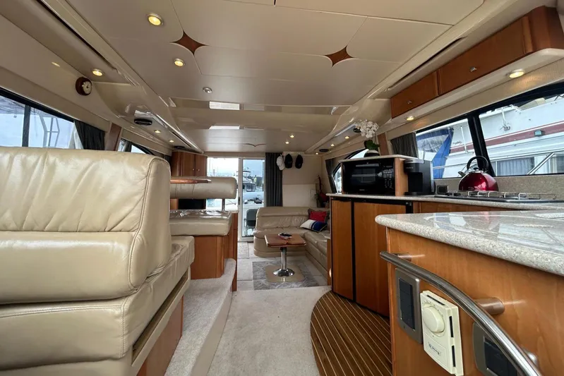  Yacht Photos Pics Luxurious interior of a 2004 Meridian 411 Sedan yacht with leather seating and modern amenities.