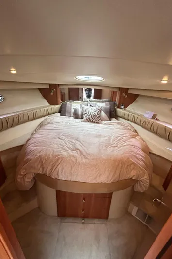  Yacht Photos Pics Luxurious cabin interior of a 2004 Meridian 411 Sedan yacht with plush bedding.