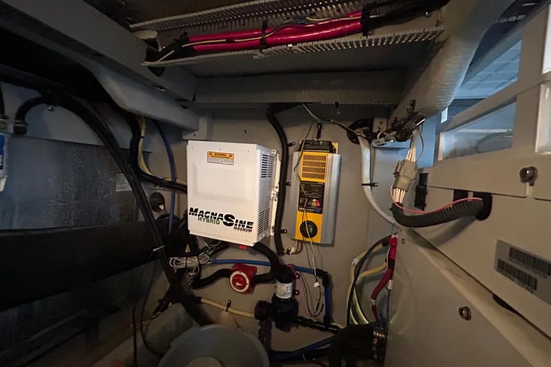  Yacht Photos Pics Electrical system inside a 2004 Meridian 411 Sedan boat, featuring wiring and control panels.