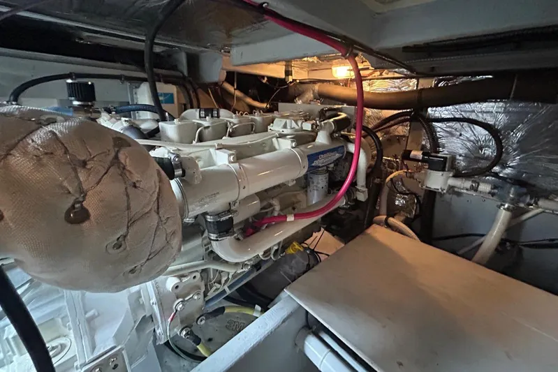  Yacht Photos Pics Engine room of a 2004 Meridian 411 Sedan, showcasing mechanical components and wiring.