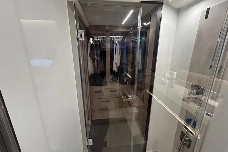  Yacht Photos Pics Modern bathroom with glass shower door in 2023 Prestige 590 yacht.
