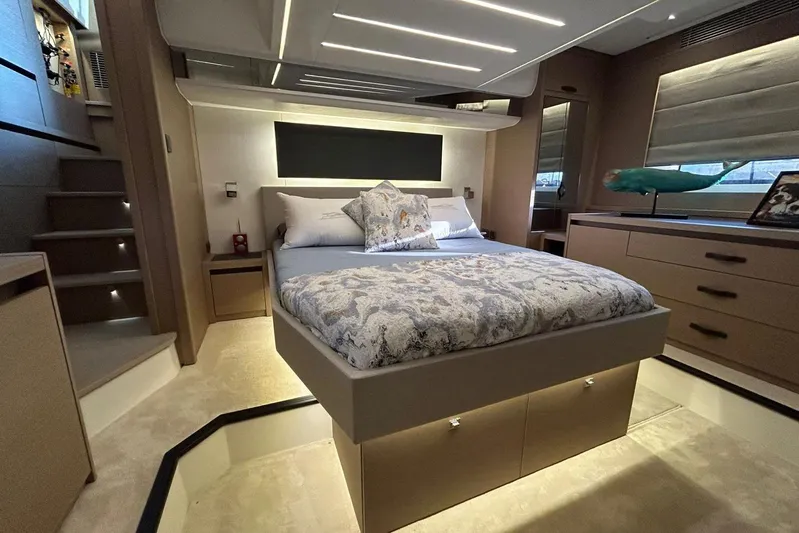  Yacht Photos Pics Luxurious bedroom interior of 2023 Prestige 590 yacht with modern design and elegant furnishings.