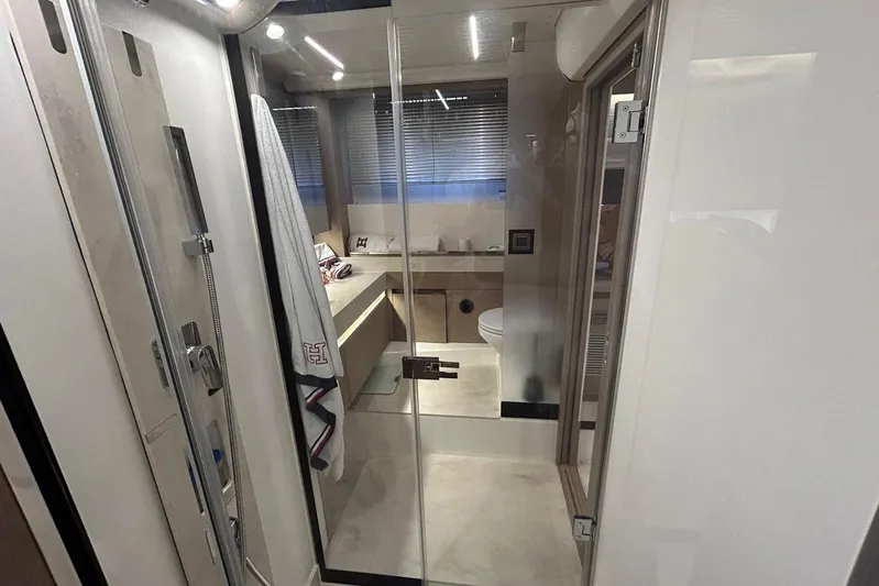  Yacht Photos Pics Luxurious bathroom interior of 2023 Prestige 590 yacht, featuring modern fixtures and elegant design.