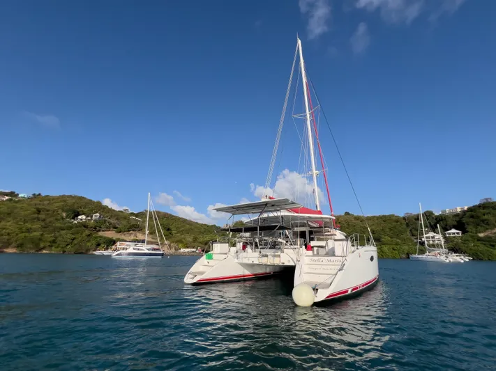 Stella Maris Yacht Photos Pics 2008 Fountaine Pajot Eleuthera 60 catamaran anchored in scenic bay with clear blue skies.