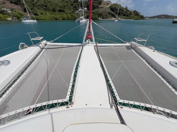 Stella Maris Yacht Photos Pics Deck view of 2008 Fountaine Pajot Eleuthera 60 catamaran in a serene bay.