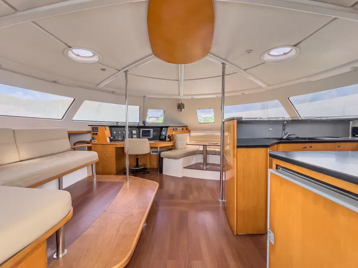 Stella Maris Yacht Photos Pics Luxurious interior of 2008 Fountaine Pajot Eleuthera 60 catamaran with modern seating and navigation area.