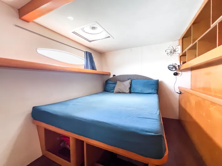 Stella Maris Yacht Photos Pics Cozy cabin interior of 2008 Fountaine Pajot Eleuthera 60 catamaran with blue bedding.