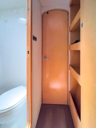 Stella Maris Yacht Photos Pics Interior of 2008 Fountaine Pajot Eleuthera 60 yacht, featuring bathroom and wooden shelving.