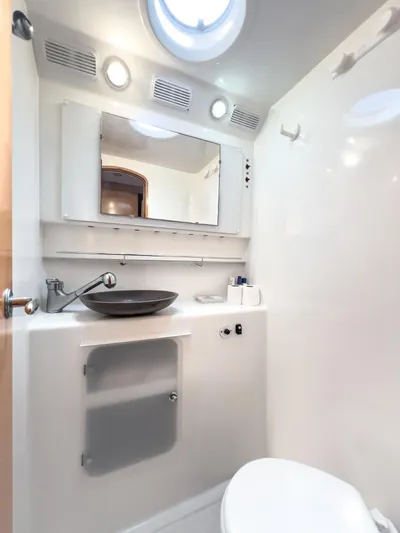 Stella Maris Yacht Photos Pics Modern bathroom in 2008 Fountaine Pajot Eleuthera 60 yacht, featuring sleek fixtures and ample lighting.