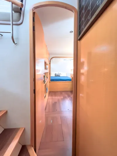 Stella Maris Yacht Photos Pics Interior view of 2008 Fountaine Pajot Eleuthera 60 catamaran, featuring a cozy cabin with wooden finishes.